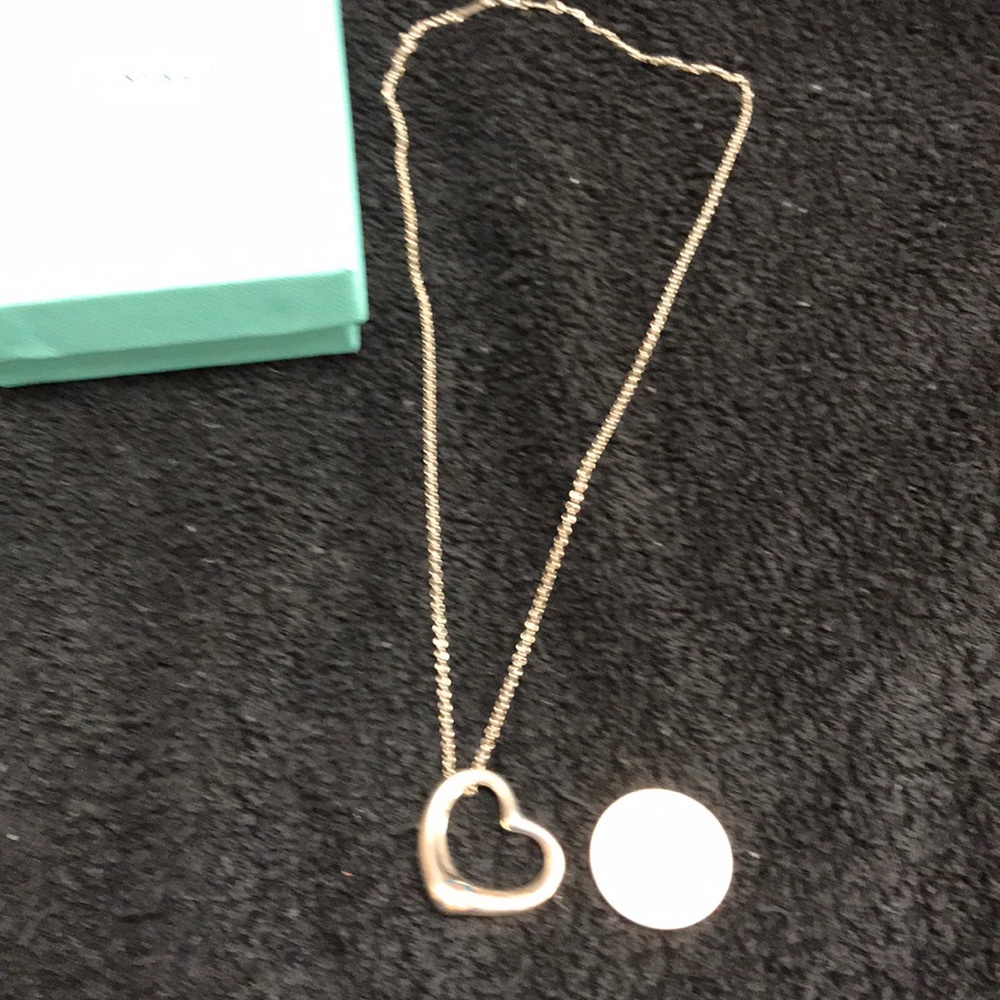 Tiffany & co Heart pendant. “18” inch chain.